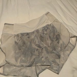 Running shorts with zipper in back